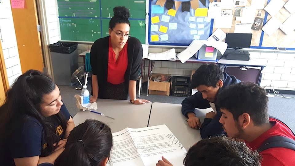 KIPP Denver Collegiate teacher Ashley Farris with students in a classroom