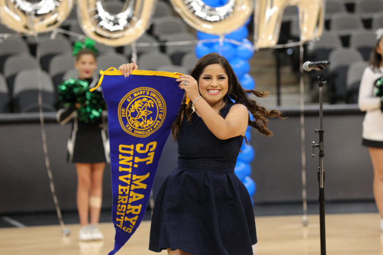 KIPP senior Ainara Mora carries a St. Mary's University flag