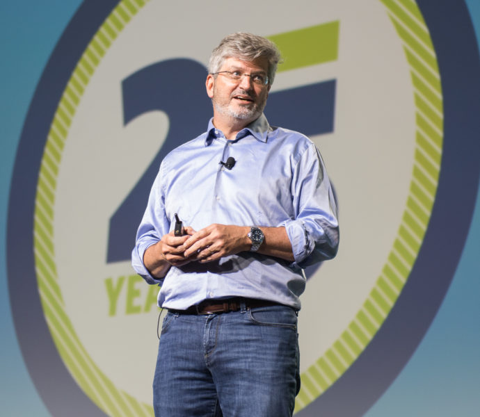 Photo shows Richard Barth, CEO of the KIPP Foundation, speaking on stage at the 2019 KIPP School Summit