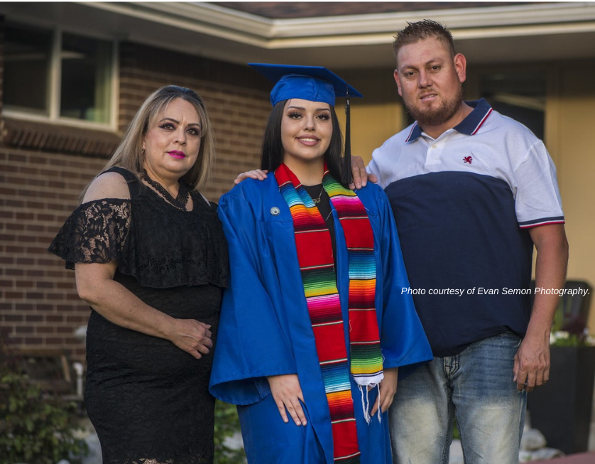 A KIPP graduate with her family.