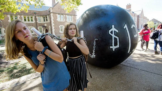 Students pull a mock “ball & chain” representing outstanding student debt at Washington University in St Louis, Missouri.